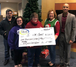 Ideal CU member and 2018 Week #4 winner Colleen Jones, (center), knew about the Holiday Debit Card giveaway but had never won anything, so it made her day! She planned to use her $1,000 for Christmas.