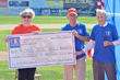 Charlie Nicodemus, right, and Phil Berkheimer, center, present a check symbolizing the creation of the $1 million First Century Trust fund at the Community Foundation to Club President Joanne McCoy