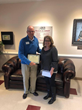 Norman Potter presents a check from the Jean Griswold Foundation to Davie County Senior Services Director Kim Shuskey.