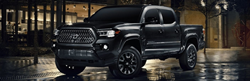 Black 2021 Toyota Tacoma Nightshade Edition on a City Street