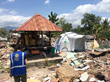 ShelterBox disaster relief tent provides shelter amid rubble after the 2018 earthquake in Indonesia.