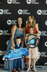 Moms and children pose for photos at Stork Ball 2022 hosted by Save the Storks 
