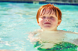 boy swimming in pool