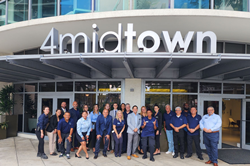 FirstService Residential associates in front of the 4 Midtown building in Miami.