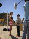 Burt Reynolds stands in a hole to get a bigger laugh from a scene with volleyball sex symbol Gabrielle Reece in a scene from &#039;Cloud 9,&#039; the motion picture written and produced by Brett Hudson, Burt Kearns & Albert S. Ruddy, released with Frozen Pictures extras January 3 on a Fox Home Entertainment DVD. (Frozen Pictures)