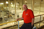 Ice House President Bob Alligood poses above the assembly floor of the manufacturing plant in Moultrie, GA.