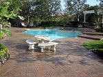 Decorative concrete is a great choice for pool deck materials.