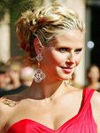 Heidi Klum&#039;s distinctive, self-designed, clove-shaped chandelier earrings