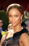 Tyra Banks wore long cascading diamond earrings as part of a multi-million dollar collection she displayed at the 2006 EmmyÂs
