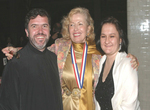 Medalist Mira Zivkovich with Father Majstorovic and his wife Miriana at the banquet that took place in the Great Hall on Ellis Island