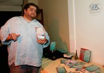 Jorge Garcia, winner of GBK&#039;s / WPT&#039;s Poker Tournament with one of his many gifts. 