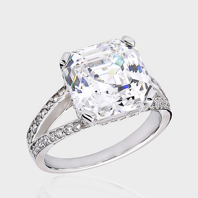 Lovely 8.0 carat asscher-inspired cubic zirconia engagement ring with bead-set round stones in split band.