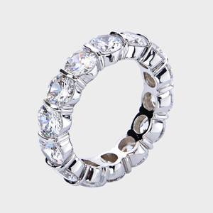 This high quality cubic zirconia ring features brilliant round stones channel set vertically in between gold bars.