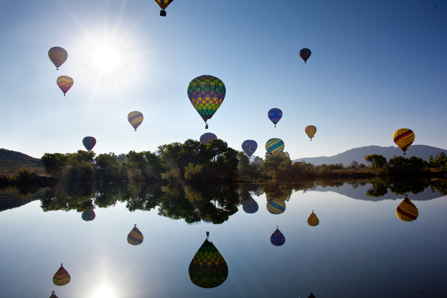 Sunrise over Lake Skinner during the Temecula Valley Balloon & Wine Festival hot air balloon launch