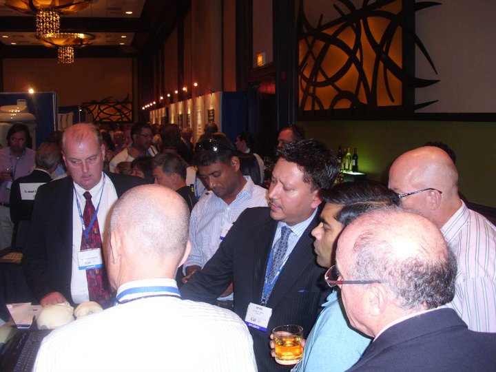 Dr. Atcha explains zygomatic dental implants (no jaw bone solution) to other Drs in a dental implant convention.
