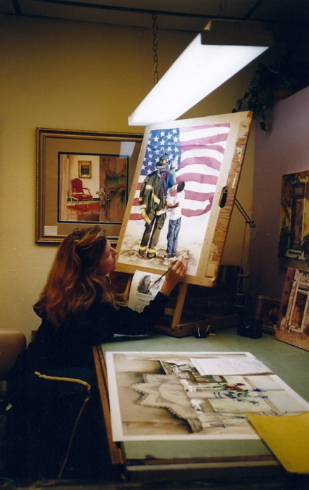 Pomm painting "Unspoken Courage" in her Glendale studio
