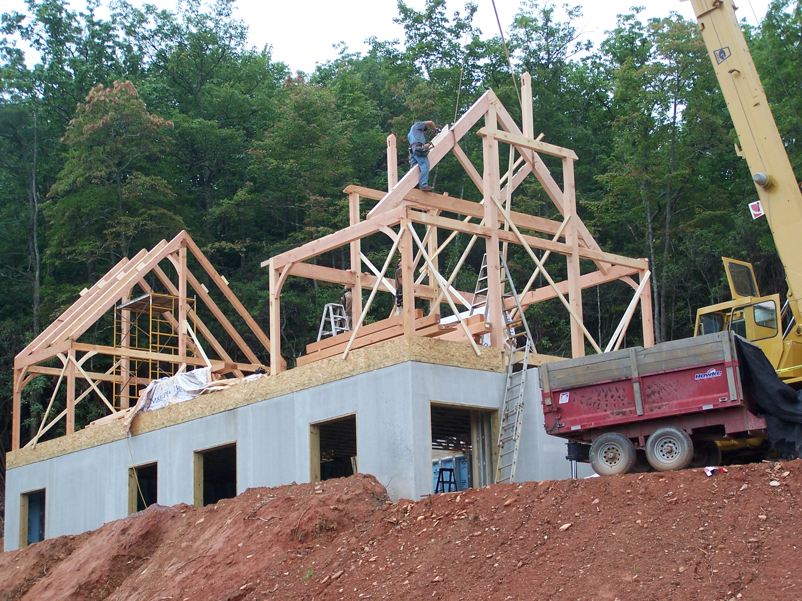 Timber-framed house starts with Superior Walls foundation.