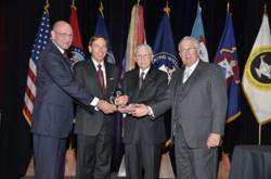 David H. Petraeus, retired Army General and current Director of the Central Intelligence Agency, is presented with the CGSC Foundation’s 2012 Distinguished Leadership Award from Foundation leadership at a dinner banquet May 10, in Kansas City, Mo. From le