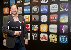 Calvin Carter in front of app wall with Bottle Rocket clients