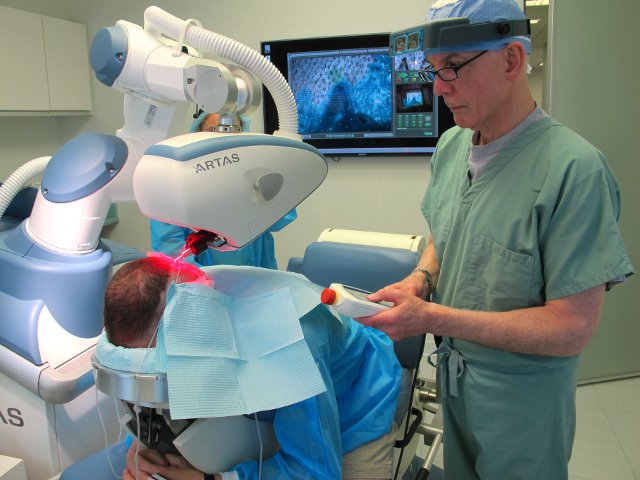 Dr. Bernstein performing Robotic FUE hair transplant in his practice in New York City
