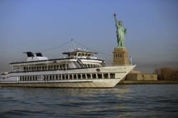 The Duchess, owned by World Yacht at Pier 81, sails near the Statue of Liberty