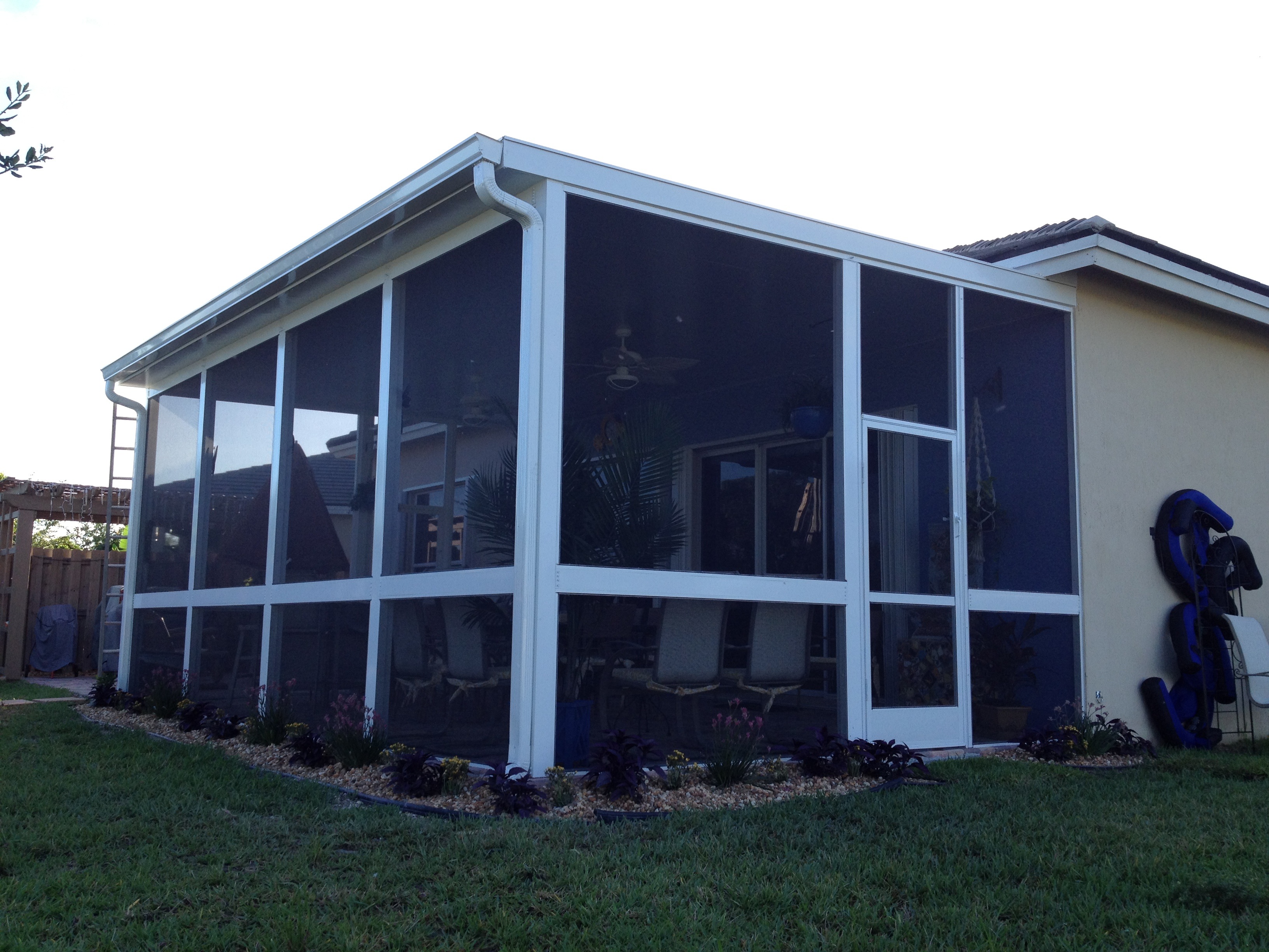 Venetian Builders, Inc., of Miami, Fla., designs screen patio enclosures such as this one to convert economically later to a glass-enclosed or insulated sunroom.