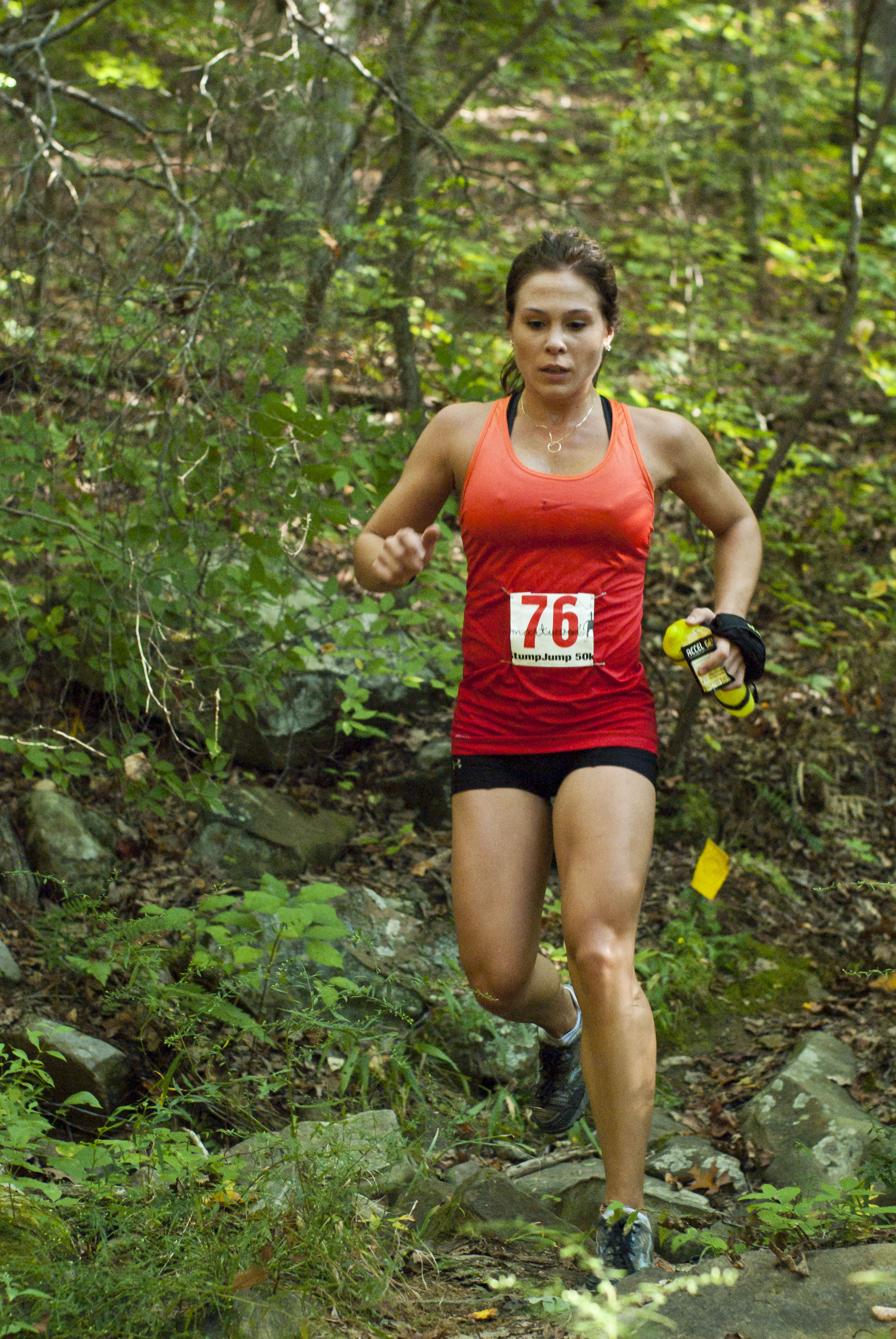 A runner enjoys narrow single track trail typical of this Southeastern trail running series.