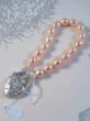 One of a kind apricot freshwater pearl with sterling silver padlock heart clasp