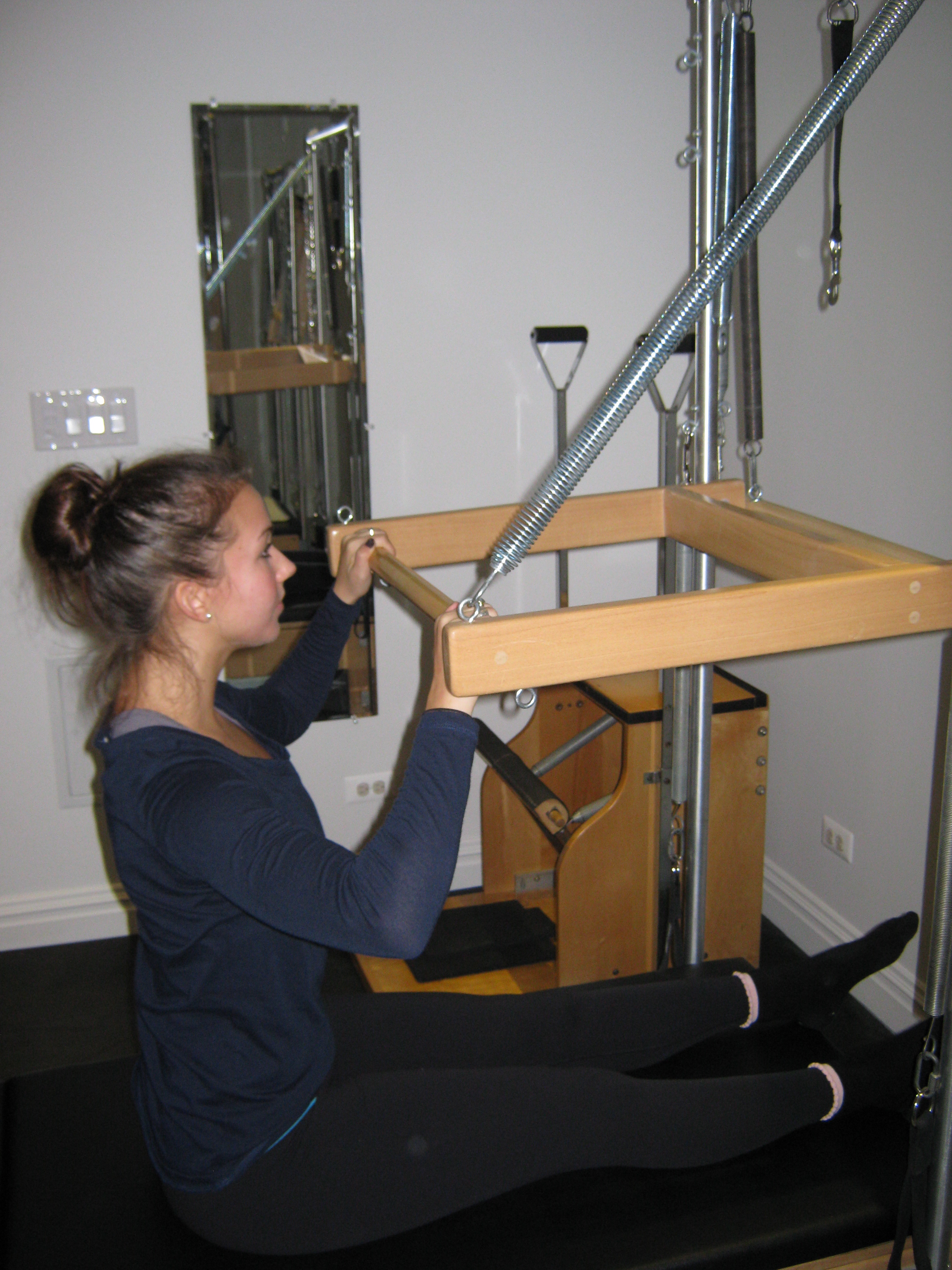 Pilates Tower Push Through Exercise for shoulder girdle stability & triceps muscle toning
