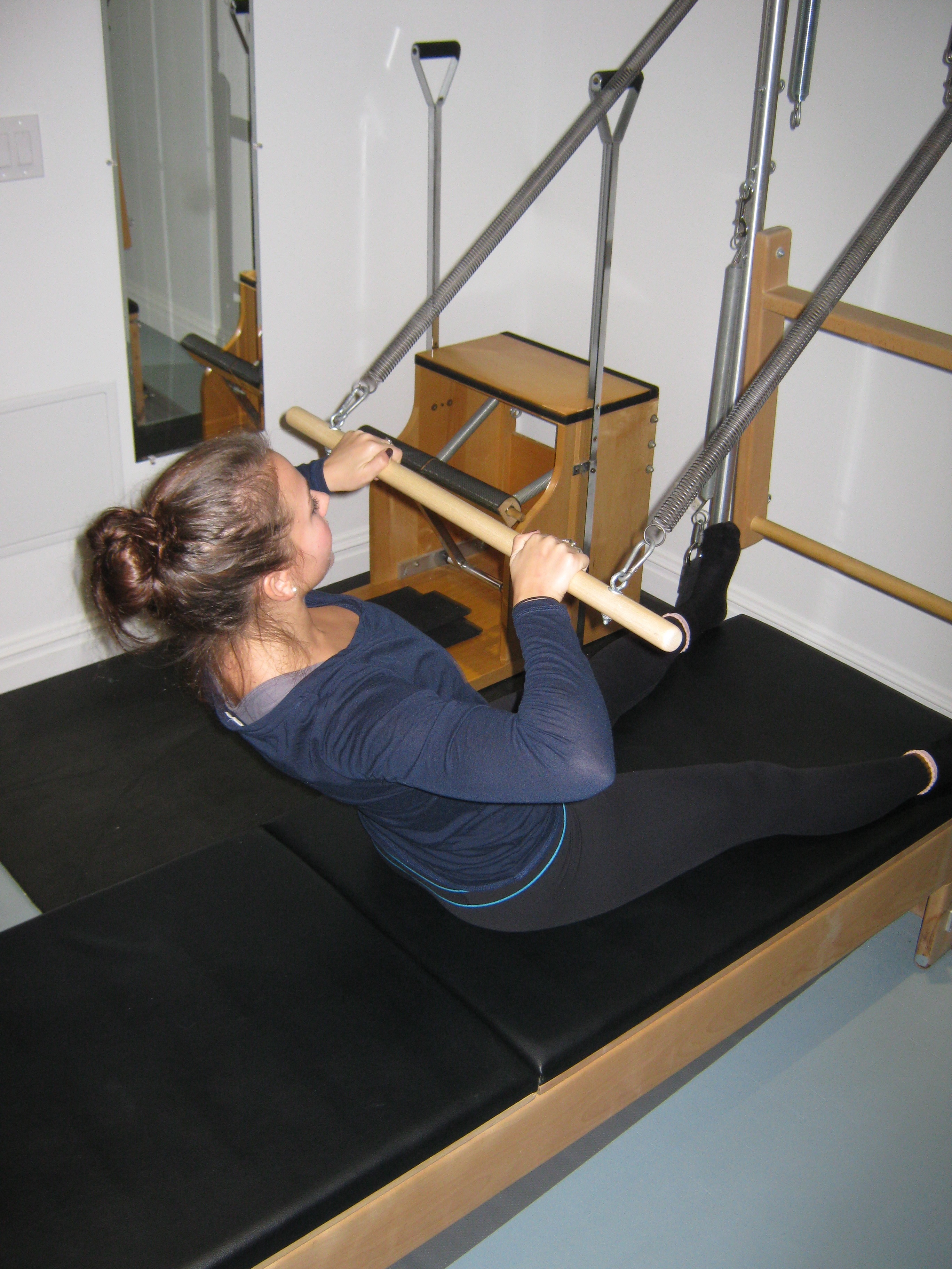 Pilates Roll Down Bar Exercise for abdominal strength & pectoral muscle toning