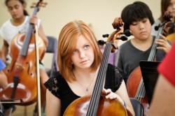 Students learning to play string instruments during 8th grade music class at this private school in Pasadena