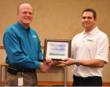 Jason Borawski (left) completes The Grounds Guys franchise training. Pictured with Ron Madera, President of The Grounds Guys