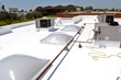 80 Mil IB (PVC) Roofing System with new double dome skylights.