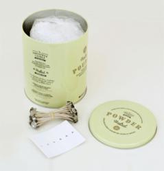 A typical kit to make candles from used cooking oil includes a bag of candle powder, cotton wicks and wick stabilizers.