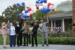 Montel Williams (2nd from right) helps to release 60 red, white and blue balloons, signifying the 60 Fisher Houses currently in operation around the world. Mr. Williams is a former Marine and a trustee of Fisher House Foundation.