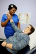 Therapist Latosha Solomon, DPT helping patient Sandy Hayes