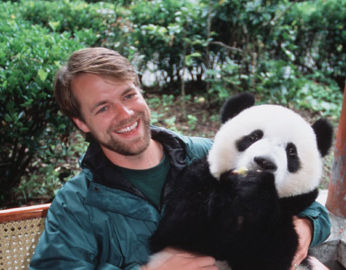 Volunteer Holding A Panda