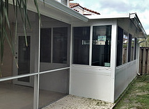 Venetian Builders, Inc., Miami, built this Davie sunroom with smaller windows to serve as a home office.