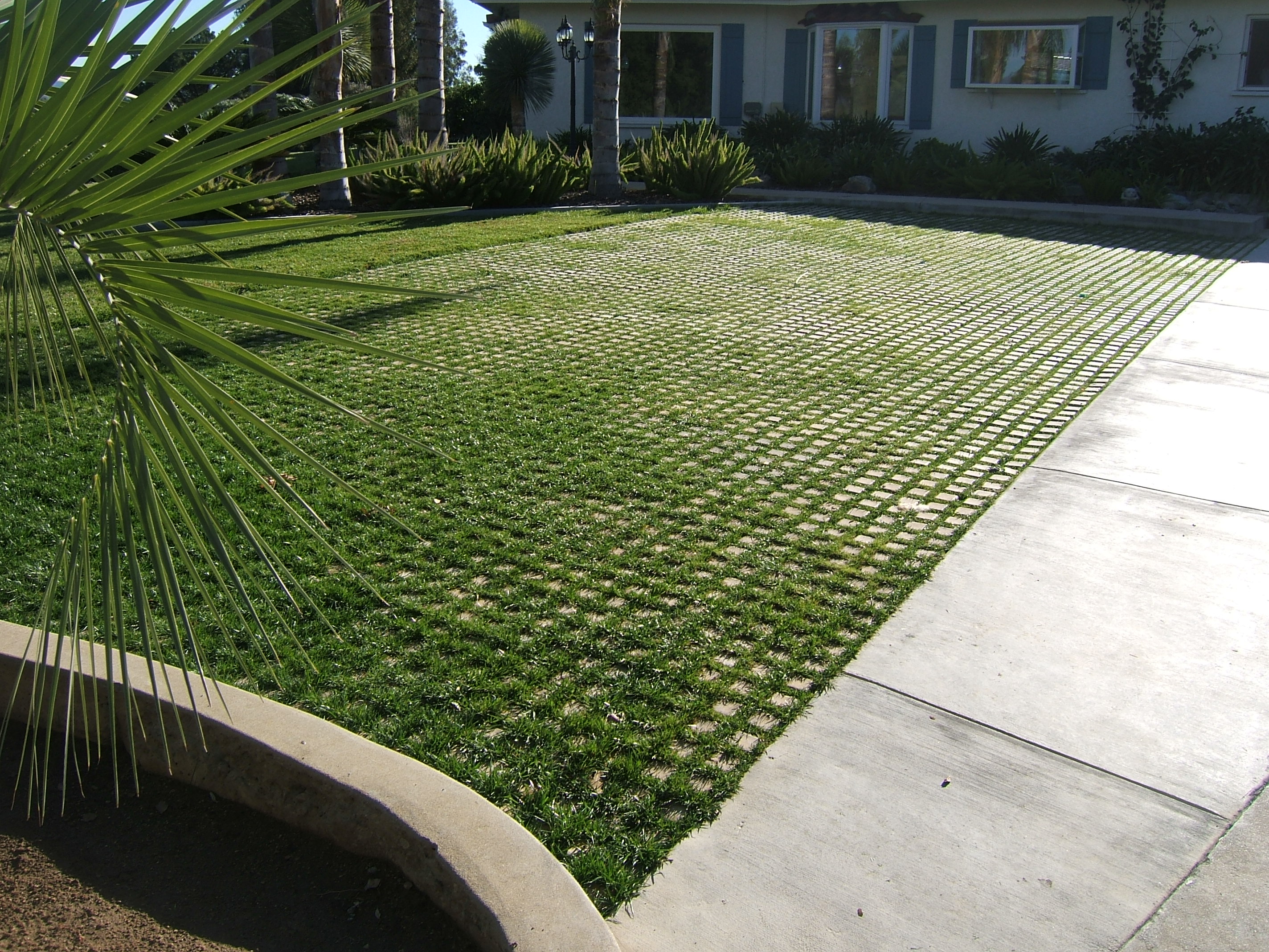 Drivable Grass pavers and sod for a green parking space.