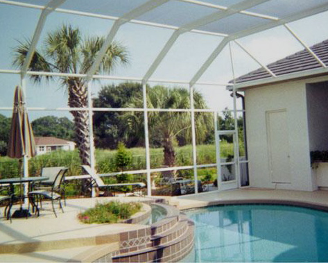 A swimming pool screen enclosure from Venetian Builders, Inc. Users enjoy bug-free swimming and sunbathing, and prized views.