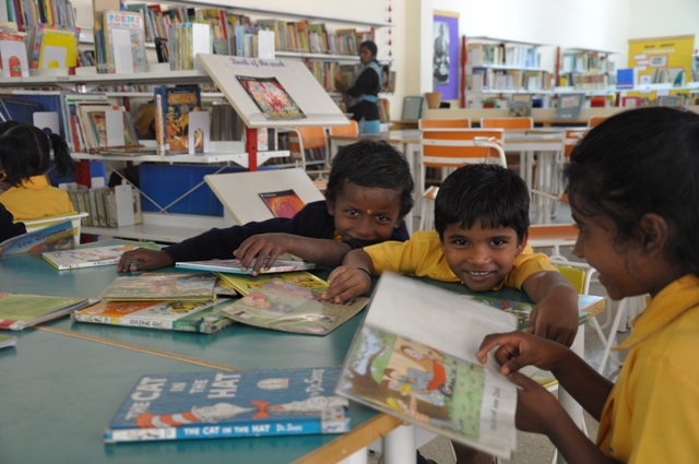 Christel House India students reading in the library