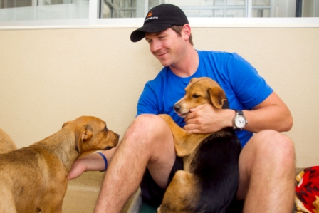 NASCAR driver Micahel Annett and puppies at Best Friends Animal Sanctuary