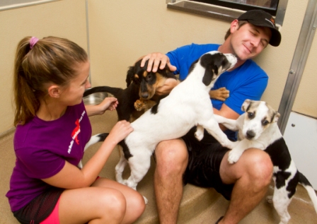 Puppies at Best Friends Animal Sanctuary are adoring fans of NASCAR driver Michael Annett.