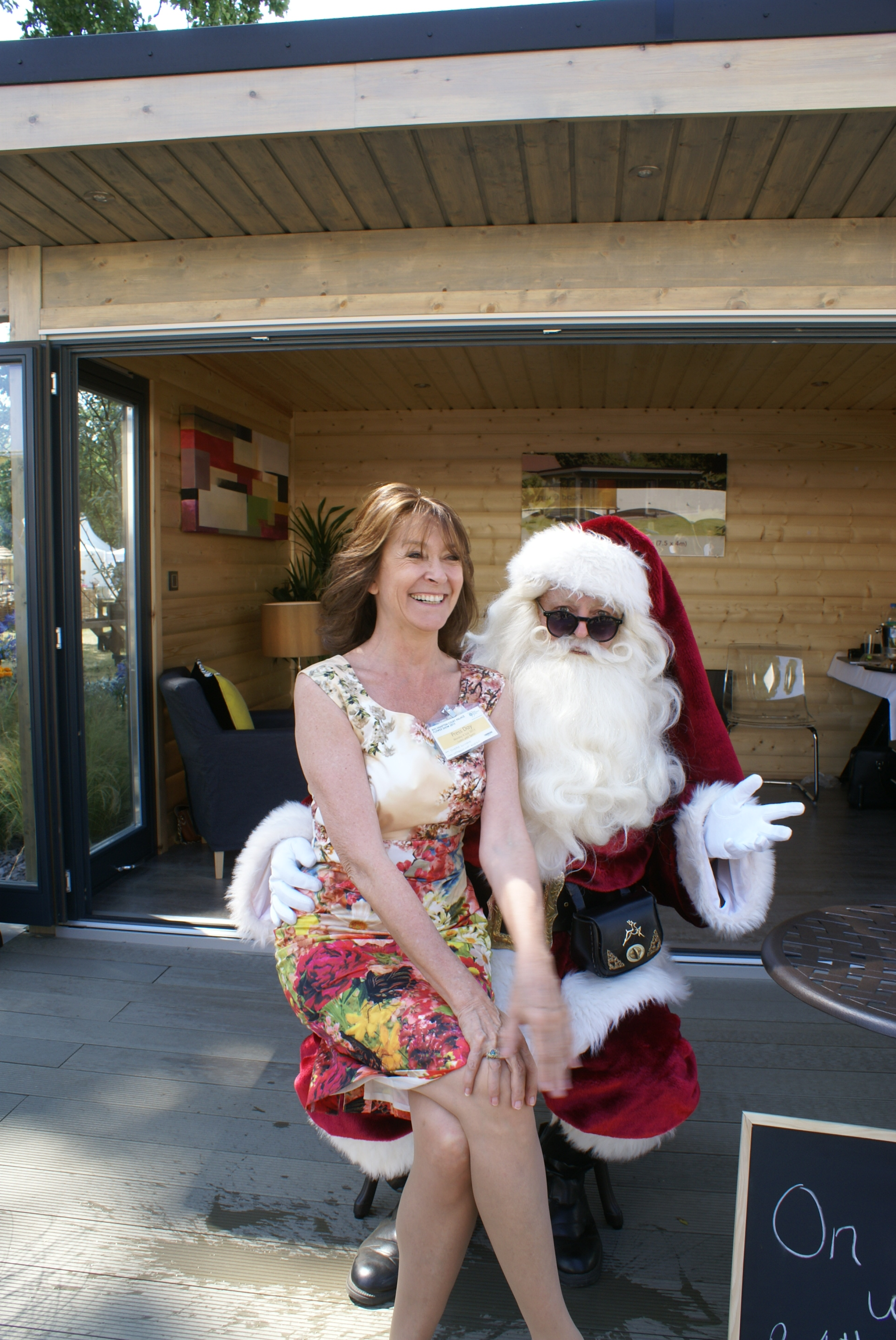 Cherie Lunghi and Santa cuddle up in his Inovar garden room