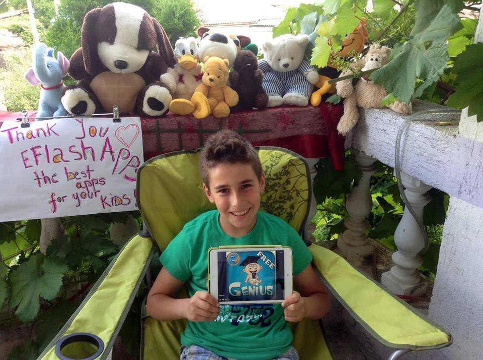 EFlashApps iPad Mini winner's son from Romania is excited to have his new iPad!