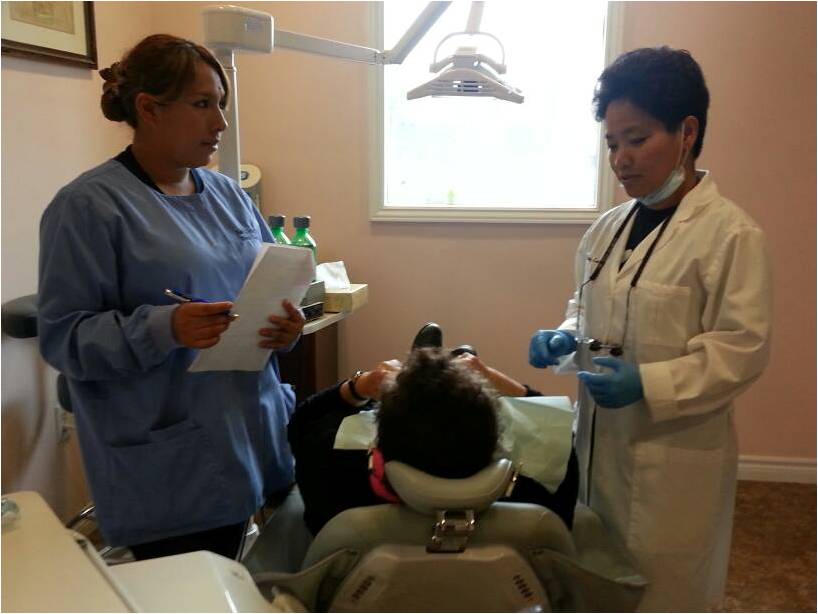 Dr. Letran performing one of her free treatments on a grateful patient