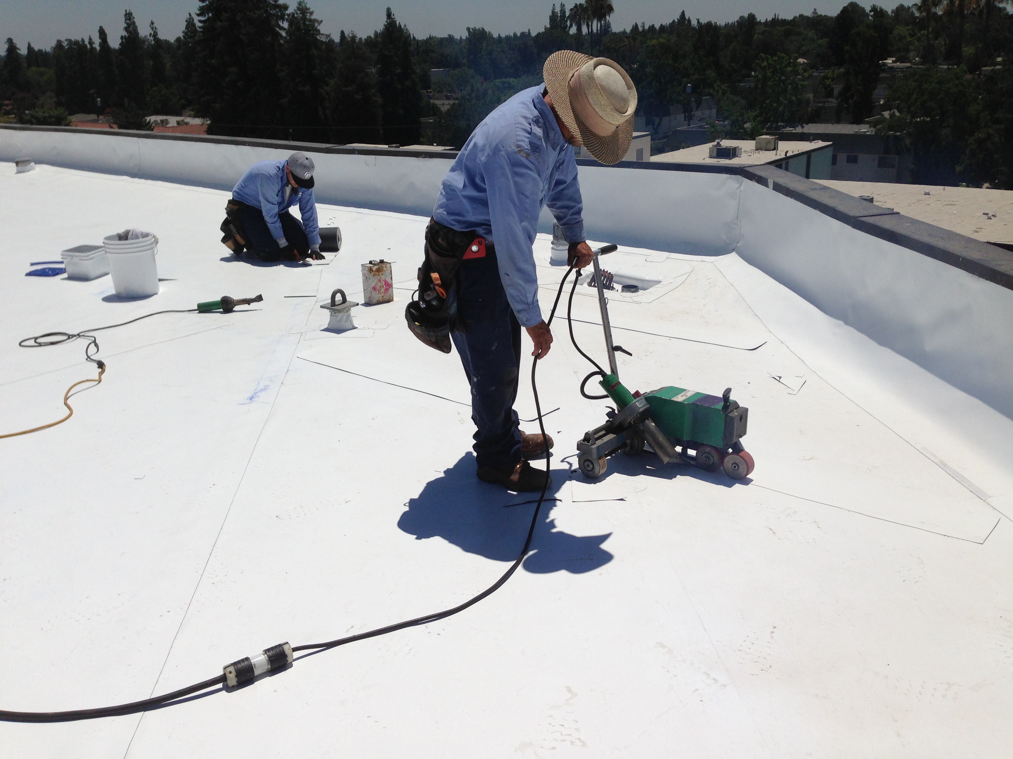 PACE-qualifying cool roof solutions can reduce the energy bills of commercial office structures by 15 - 20%.  (Credit: Fryer Roofing)
