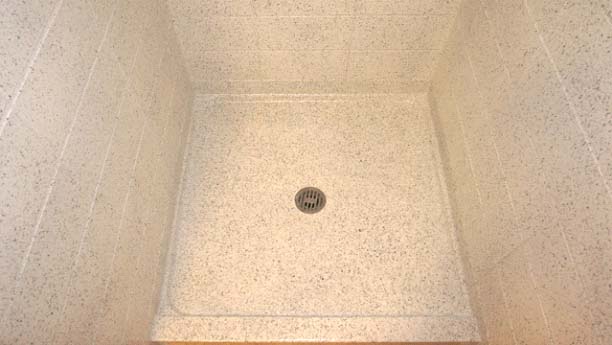 Miracle Method refinished over all of the tile and sealed in the grout lines, therefore making the showers easy to keep clean