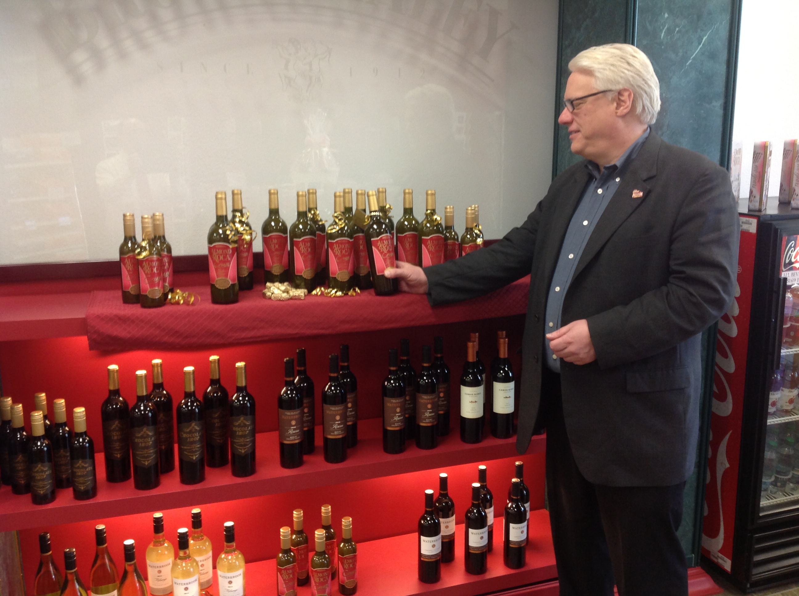 Michael Hartzell selecting the bottle of ALMOND ROCA® Cream