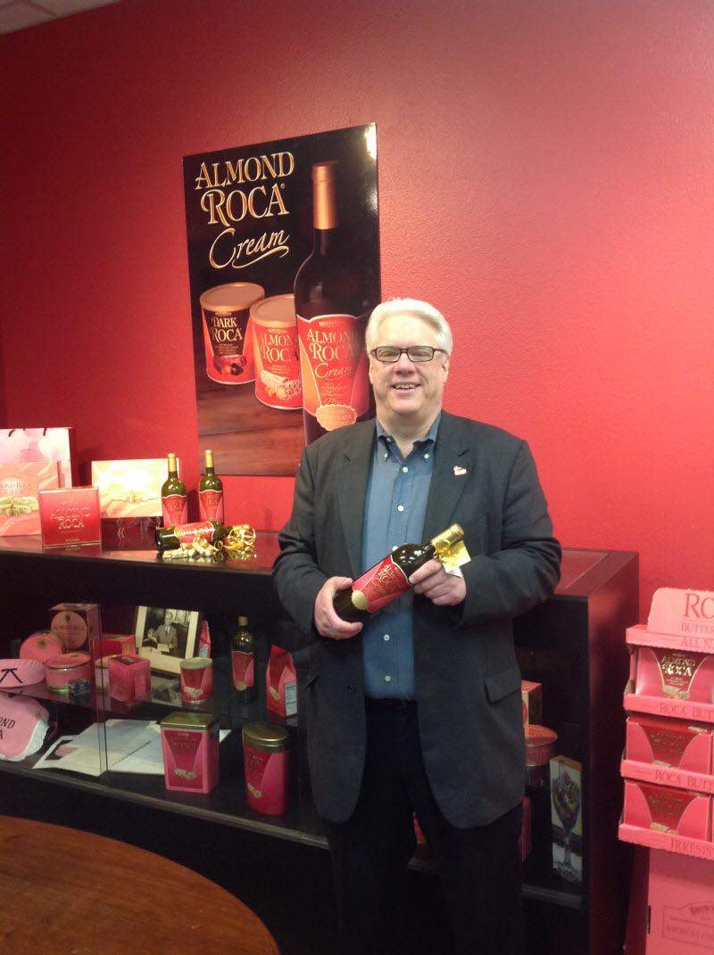 Michael Hartzell shows off his new bottle of ALMOND ROCA® Cream